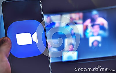 Hand use videoconference app icon of Zoom Meeting. Editorial Stock Photo