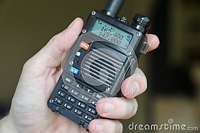 Hand using amateur radio walkie talkie Stock Photo