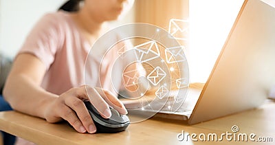 Hand using computer sending message with envelope icon Stock Photo