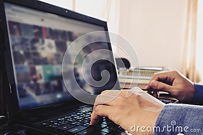 Hand using laptop,selective focus, vintage tone Stock Photo