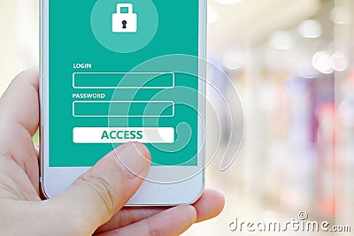 Hand using smart phone with password login on screen over blur b Stock Photo