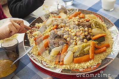 Couscous plate on a family table Stock Photo