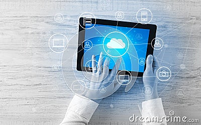 Hand using tablet with centralized cloud computing system concept Stock Photo