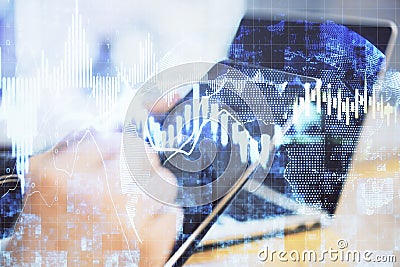 Hand using tablet computer with business charts Stock Photo