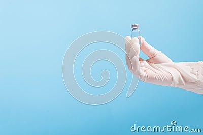 Hand with vaccine dose. Medicine container in hand with copy space Stock Photo