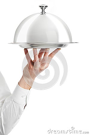 Hand of waiter with cloche lid Stock Photo