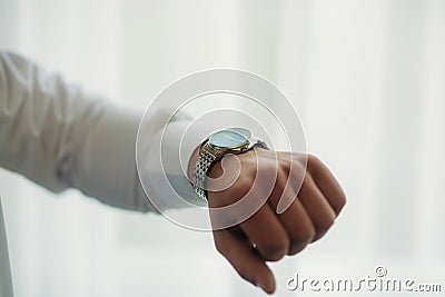 Hand with watch. groom in wedding morning Stock Photo