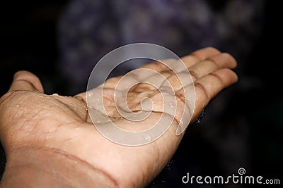 Hand with waterdrop Stock Photo