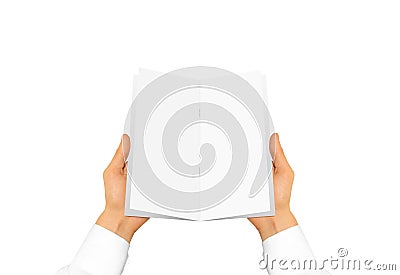 Hand in white shirt sleeve holding blank brochure booklet in the Stock Photo