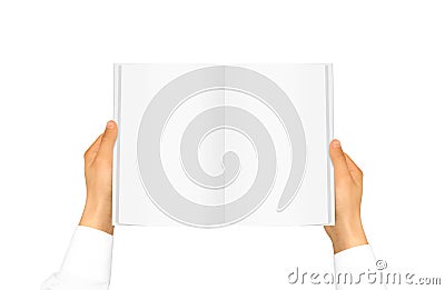 Hand white shirt sleeve holding book Stock Photo