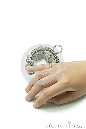 Hand wiith Jeweler finger sizing tools isolated Stock Photo