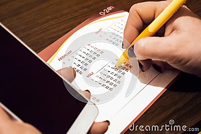 Hand woman checking meeting plan in calendar background Stock Photo