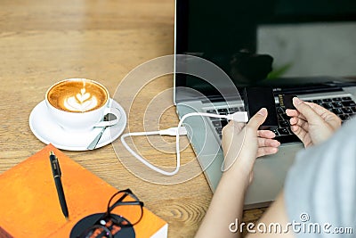 Hand woman inserting memory card into card reader Stock Photo