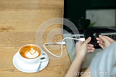 Hand woman inserting memory card into card reader Stock Photo