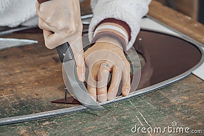 hand of woman master glassmaker at work Stock Photo