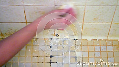 Hand Of A Woman Starting To Clean A Disgusting Shower Floor That