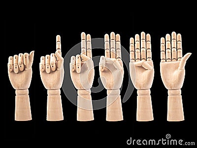 Hand of wood doll make fingers to Counting numbers 0 through 5 on black bakground Stock Photo