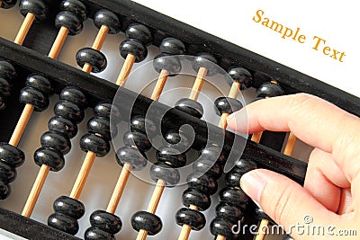 Hand and a wooden abacus with copy space Stock Photo