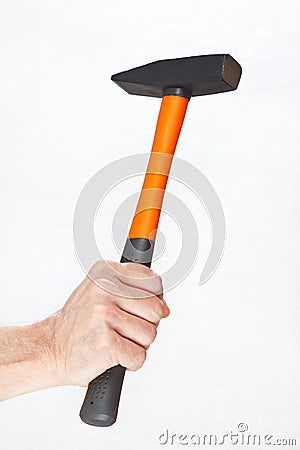 Hand of a workman holding a hammer on white background Stock Photo