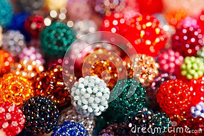 Hand-wowen colorful balls made of tiny glass seed beads Stock Photo