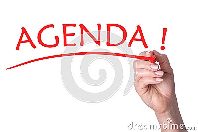 Hand writes word agenda with red marker Stock Photo