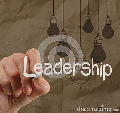 Hand writing leadership with crumpled recycle paper Stock Photo