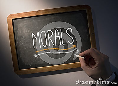 Hand writing Morals on chalkboard Stock Photo