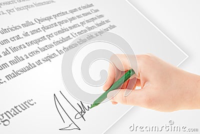 Hand writing personal signature on a paper form Stock Photo