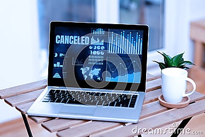 Hand writing sign Canceled. Word Written on to decide not to conduct or perform something planned or expected Laptop Stock Photo