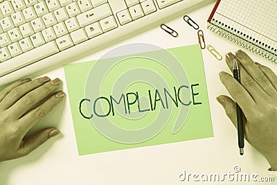 Hand writing sign Compliance. Word Written on the action or fact of complying with a wish or commands Stock Photo