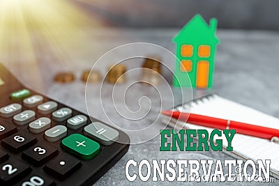 Hand writing sign Energy Conservation. Business concept Reduction in the amount of energy consumed in a process Stock Photo