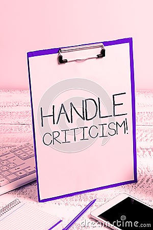 Hand writing sign Handle Criticism. Word for process of withstanding valid and well reasoned opinions Stock Photo