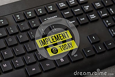 Hand writing sign Implement. Word Written on give practical effect to specific steps to ensure real attainment Stock Photo