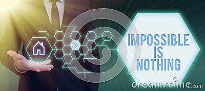 Writing displaying text Impossible Is Nothing. Concept meaning Motivated to achieve something despite challenges Stock Photo