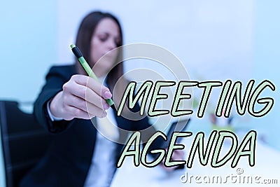 Hand writing sign Meeting Agenda. Word Written on An agenda sets clear expectations for what needs to a meeting Stock Photo
