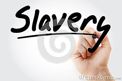 Hand writing Slavery with marker Stock Photo