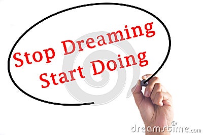 Hand writing Stop Dreaming Start Doing on transparent board Stock Photo