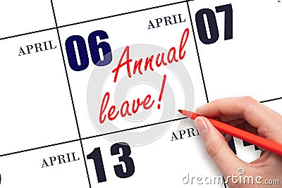 Hand writing the text ANNUAL LEAVE and drawing the sun on the calendar date April 6 Stock Photo