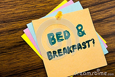 Hand writing text caption inspiration showing Bed Breakfast. Business concept for Holiday Journey Travel written on sticky note p Stock Photo