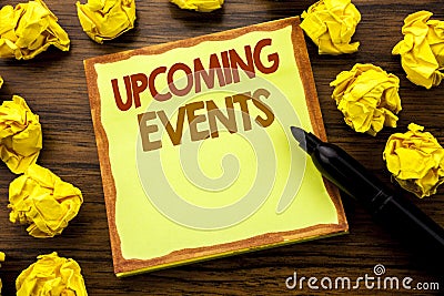 Hand writing text caption showing Upcoming Events. Business concept for Appointment Agenda List Written on sticky note paper, wood Stock Photo