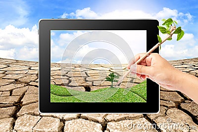 Hand writing Think Green Ecology on tablet Stock Photo