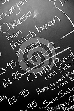 Hand written chalk menu board featureing various ingredients Stock Photo