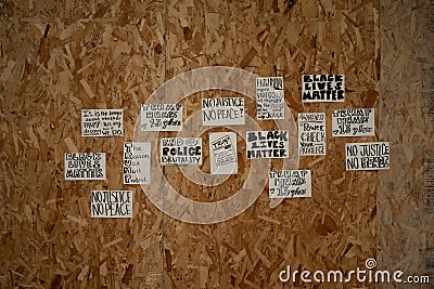 Hand written protest signs taped to plywood Editorial Stock Photo