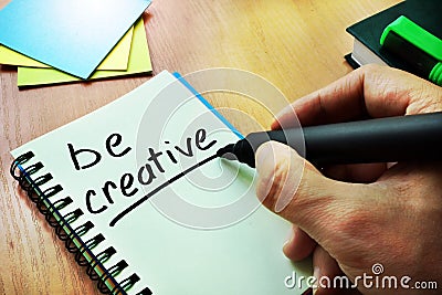 Hand writting title Be creative. Stock Photo