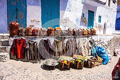 Handbags and clothing front of the shop, Chefchaouen, Morocco Stock Photo