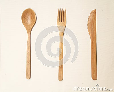 Handcraft wooden spoon, fork and knife on isolated white background Stock Photo