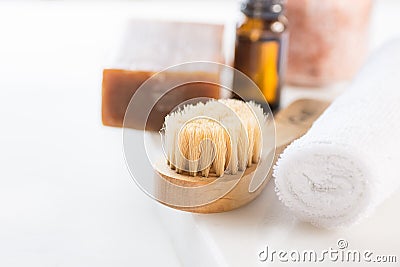 Handmade Coal Tar Soap Brush Pink Himalayan Salt Essential Oil Towel on White Marble Background. Spa Wellness Relaxation Body Care Stock Photo