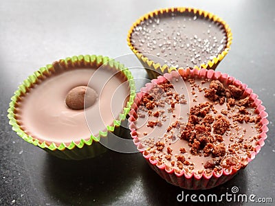 Handcrafted no bake peanut butter cups. Chocolate, freshly ground peanut butter and flavor combinations. Stock Photo