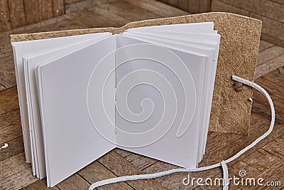 Handcrafted Notebook on Rustic Wood Surface with String Closure Stock Photo