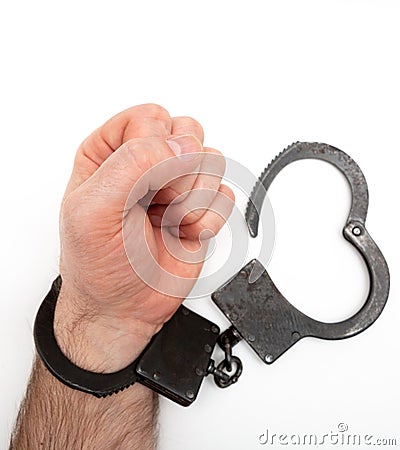 Handcuffed hand isolated on white background Stock Photo